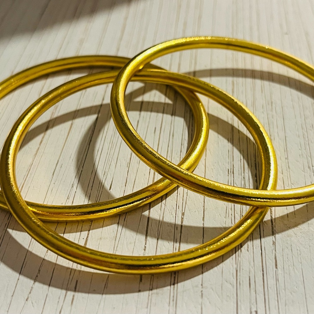 Gorgeous set of 3 matte gold toned bracelets!